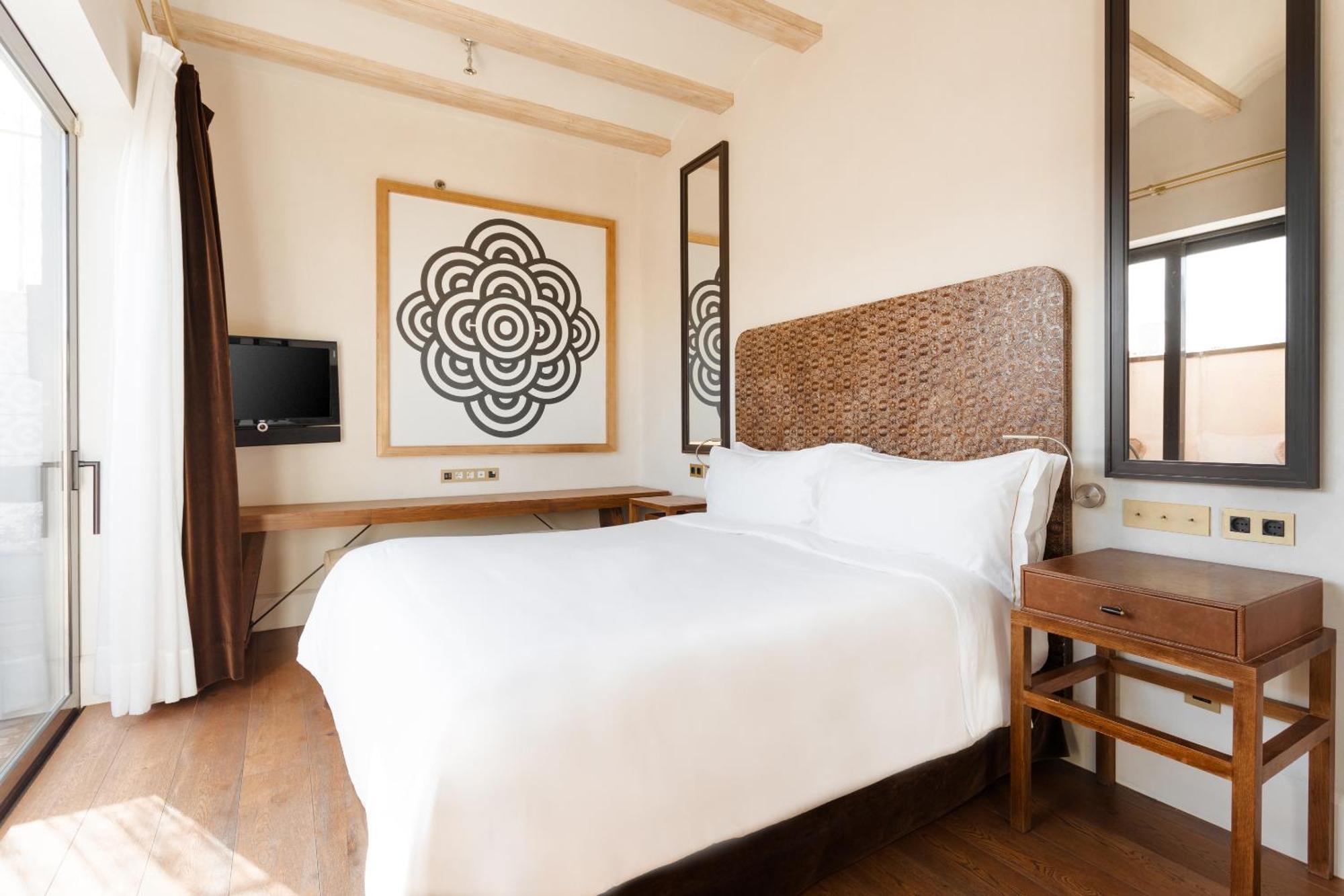 ホテル ドゥ プラカ レイアル ジーアール バルセロナ 部屋 写真 A bedroom at the hotel